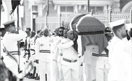  ?? ?? PATRIOTIC FAREWELL: The casket of former prime minister Basdeo Panday, draped in the national colours of red, white and black, is transporte­d to the Red House in Port of Spain under military escort for a public viewing of his body on Friday. —Photo: ISHMAEL SALANDY