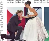  ?? — AP ?? Singer Bono kisses Penelope Cruz’s hand after she received the Donostia Award at the 67th San Sebastian Film Festival in Spain on Friday.