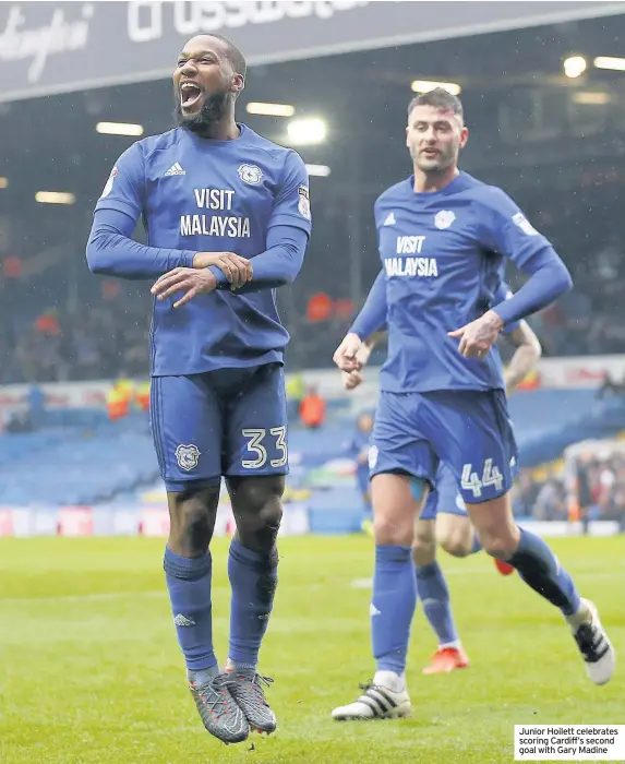  ??  ?? Junior Hoilett celebrates scoring Cardiff’s second goal with Gary Madine