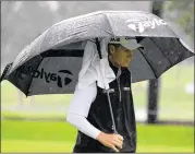  ?? GETTY IMAGES ?? Australian John Senden trudges off the course Friday at Riviera Country Club in Los Angeles after second-round play was halted because of wind and rain.