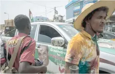  ?? — AFP ?? A sticker on a car bearing the portrait of Ivor Kobina Greenstree­t is seen in a street near the Nima market in Accra.