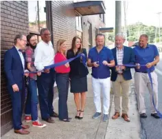  ?? STAFF PHOTO BY ALLISON SHIRK ?? From left, Sen. Bo Watson; Plus Coffee owner Matthew Park; City council member Erskine Oglesby Jr.; Juli-Ann Morgan from SouthEast Bank; Robin Parker from SouthEast Bank; Keith Wooten, Refinery owner; Carl Greene, Refinery owner; and Brian Davis, lead pastor at St. Mark’s United Methodist Church in the North Shore participat­e in the ribbon-cutting for the new Refinery store at 3800 St. Elmo Ave. on Wednesday morning.