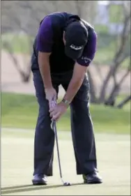  ?? MATT YORK — THE ASSOCIATED PRESS ?? Phil Mickelson reacts after missing a par putt on the 13th green in the second round of the Phoenix Open on Friday.