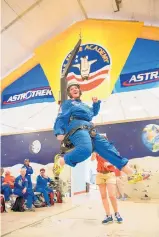  ?? COURTESY PHOTO ?? Moriarty teacher Jodie Guillen learns how it feels to walk on the moon via a one-sixth gravity chair at NASA Space Camp.