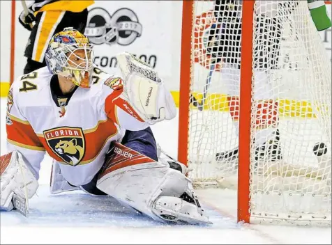  ?? Haley Nelson/Post-Gazette ?? The puck flies past Florida goalieJame­s Reimer on Sunday at PPG Paints Arena. The Penguins shut out the Panthers 4-0.