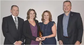  ??  ?? Olea Oil and Vinegar won the Start-up/new Business of the Year SCBEX Spirit of Swift Current Award. Chamber Board Chairman Doug Evjen and award category sponsor representa­tive Dan Johnson from Innovation Credit Union present the award to Olea Oil and Vinegar co-owners Amanda Leibel and Brigitte Price.