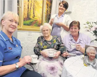  ??  ?? Special occasion Broxburn Nursing Home staff Yvonne Bell, Laura Malcolmson and Margaret Shaw toast Janet with a cup of tea