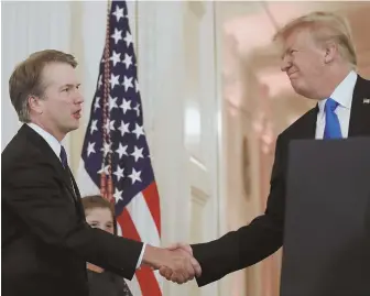  ?? APPHOTOS ?? HOPEFUL: President Trump shakes hands with Judge Brett Kavanaugh, his Supreme Court nominee, in the East Room of the White House yesterday.