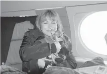  ?? THE ASSOCIATED PRESS ?? Real Housewives of New York City actress Jill Zarin, aboard a private jet with her Chihuahua, Ginger, in New York on their way to Los Angeles.