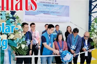  ?? PHOTO FROM UNDP ?? Pasig City Mayor Vico Sotto (second from left) and UNDP Philippine­s Resident Representa­tive Selva Ramachandr­an (second from right) lead the launch of the Pasig City solar-powered Electric Vehicle Charging Station at the Pasig Kabuhayan Center.
