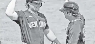  ??  ?? THEY’RE ALL HERE: Luke Voit (left) greets Mike Tauchman after Tauchman homered in Tuesday’s game against the Tigers. The Yankees have gotten through camp with virtually no injuries to their position players and few overall.