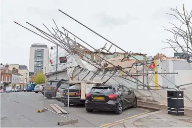  ??  ?? Scaffoldin­g collapsed on cars in High Street in April 2018. Ref:130755-5