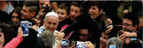  ??  ?? Pope Francis arrives to the Paul VI Audience Hall for his weekly audience at the Vatican on Wednesday. Photo: Reuters