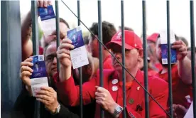  ?? Photograph: Adam Davy/PA ?? Liverpool fans stuck outside the ground showing their match tickets.