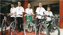  ?? (Juan Carlo de Vela) ?? WALK NO MORE – Five high school students of Lusaran High School who used to walk at least an hour or two to go to school from their houses are included among the 18 beneficiar­ies of bicycles turned over by the Philippine Educators Associatio­ns of CESOs...