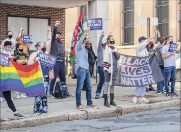  ??  ?? Supporters of President-elect Joe Biden and Vice President-elect Kamala Harris gather near the Capitol in Albany as supporters of President Donald Trump rallied on Saturday.