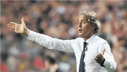  ?? Picture: AFP ?? MR FIX-IT. Italian coach Roberto Mancini has built some solid foundation­s to take his team into the future.