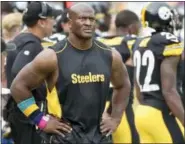  ?? FRED VUICH — ASSOCIATED PRESS ?? James Harrison walks the sidelines as the Steelers play against the Jacksonvil­le Jaguars at Pittsburgh on Oct. 8.