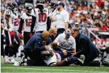  ?? JIM ROGASH / GETTY IMAGES ?? Texans offensive tackle Seantrel Henderson is tended to after suffering an ankle injury in the first half of Sunday’s loss to the Patriots. Henderson was scheduled to have surgery Tuesday and is lost for the season.