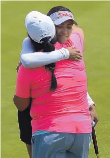  ?? GREG SORBER/JOURNAL ?? Emma Mesta-Garcia, back, representi­ng Ruidoso, gets a hug from Shannelle Tafoya after Mesta-Garcia won the regional amateur event.