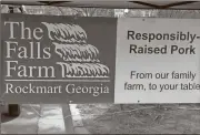  ?? Sean Williams/ Standard Journal ?? The Fall Farms of Rockmart raises their pigs locally and provides a variety of pork products at the Rockmart Farmers Market on Thursdays.