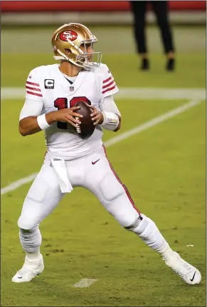  ?? THEARON W. HENDERSON/GETTY IMAGES ?? Jimmy Garoppolo of the San Francisco 49ers drops back to pass against the Los Angeles Rams during the third quarter on Oct. 18 in Santa Clara.