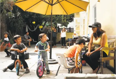  ?? Photos by Santiago Mejia / The Chronicle ?? Assistant teacher Nancy Mendez with kids at Laffodils Preschool and Child Care, which will shut in August.