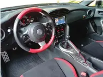  ??  ?? The 86 GT SE’s red and black interior colour scheme is a classic way to say “this can go fast.”