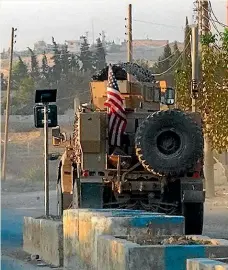  ?? AP ?? US military vehicles in northeast Syria as American troops began withdrawin­g from their positions along Turkey’s border this week.