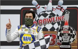  ?? TERRY RENNA / AP ?? Chase Elliott celebrates Sunday in Victory Lane after winning the NASCAR Cup Series race on the Daytona Internatio­nal Speedway road course.