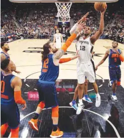 ?? (USA TODAY Sports) ?? San Antonio Spurs’ LaMarcus Aldridge (second from right) shoots the ball during the game against Oklahoma City Thunder on Thursday.