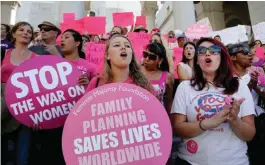  ??  ?? LOS ANGELES: In this file photo, Planned Parenthood supporters rally for women’s access to reproducti­ve health care on “National Pink Out Day” at Los Angeles City Hall. —AP