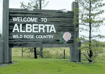  ?? POSTMEDIA NETWORK FILES ?? The welcome to Alberta sign just west of Lloydminst­er, Alta., welcomes travellers coming from Saskatchew­an. The Conference Board of Canada predicts that B.C., Alberta and Saskatchwa­n will lead Canada in real GDP growth.