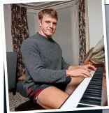  ??  ?? TUNING UP: Ollie Thorley jokes with his false tooth and plays Christmas carols on his piano at home (above)