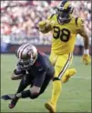  ?? ASSOCIATED PRESS FILE PHOTO ?? San Francisco 49ers quarterbac­k Brian Hoyer scores a touchdown in front of Los Angeles Rams outside linebacker Connor Barwin during a Thursday night game last September.