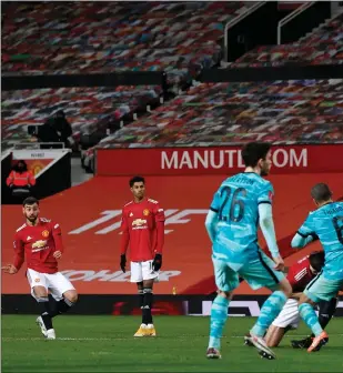  ??  ?? Bruno Fernandes sends his free-kick over the wall to score the winner for Manchester United at Old Trafford last night