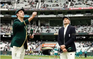  ?? ?? Pat Cummins at the toss with Joe Root