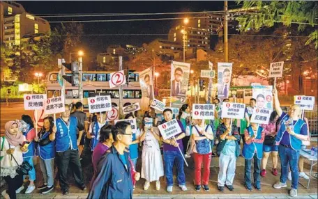  ?? Marcus Yam Los Angeles Times ?? AN ELECTION rally in the working-class Tuen Mun district, where Junius Ho, a divisive politician, later conceded defeat to Lo Chun-yu.