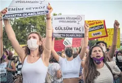  ?? AFP ?? Demonstrat­ors wearing protective face masks hold up placards yesterday during a protest for the prevention of violence against women, in Istanbul, Turkey.