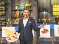  ?? Contribute­d photo ?? Host Clinton Kelly announces the rules of a watercolor cakes challenge on “Spring Baking Championsh­ip.”