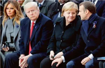  ??  ?? La postura de Donald Trump en materia medioambie­ntal –ha llegado a cuestionar el cambio climático– difiere mucho de las de otros líderes mundiales, como la canciller alemana, Angela Merkel, y el presidente francés, Emmanuel Macron.