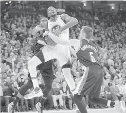  ?? MARCIO JOSE SANCHEZ/AP ?? The Warriors’ Kevin Durant, center, seen in action this month against the Trail Blazers, “just wants to play and win,” says former teammate Dion Waiters, now with the Heat.