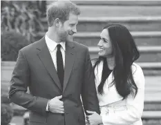  ?? EDDIE MULHOLLAND/THE ASSOCIATED PRESS ?? Prince Harry and Meghan Markle’s royal nuptials will take place on May 19 and fans from around the world are already planning their viewing parties.