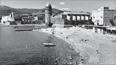  ?? CAMERON HEWITT/RICK STEVES’ EUROPE ?? Collioure’s sand-and-pebble beach ends at the Notre-Dame des Anges church, a view that has inspired many artists.