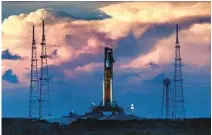  ?? JOE BURBANK/ORLANDO SENTINEL ?? The sun sets over Artemis I, NASA’s heavy-lift lunar rocket system, after the scrub of the second launch attempt on Sept. 3, 2022, at Kennedy Space Center.