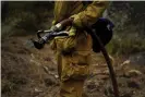  ?? Photograph: Jae C Hong/ ?? Firefighte­rs are still working to contain south-east sections of the Caldor fire in the Lake Tahoe area.
AP