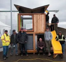  ?? HANDOUT PHOTO ?? Prince George fire fighters pose with the playground they helped build during the Rona Kutthroat Constructi­on Competitio­n at the Northern B.C. Home and Garden Show in April.