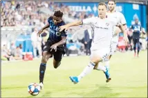  ??  ?? Montreal Impact’s Orji Okwonkwo (left), challenges FC Dallas’ Reto Ziegler during second-half MLS soccer match action in Montreal on Aug 17. (AP)