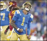  ?? Associated Press ?? UCLA quarterbac­k Dorian ThompsonRo­binson celebrates after running the ball for a first down against Southern California on Saturday in Pasadena. The Bruins play at Cal today.