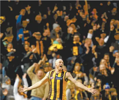  ??  ?? Hawthorn stalwart Jarryd Roughead celebrates kicking six goals in his final home game for the Hawks last Sunday.